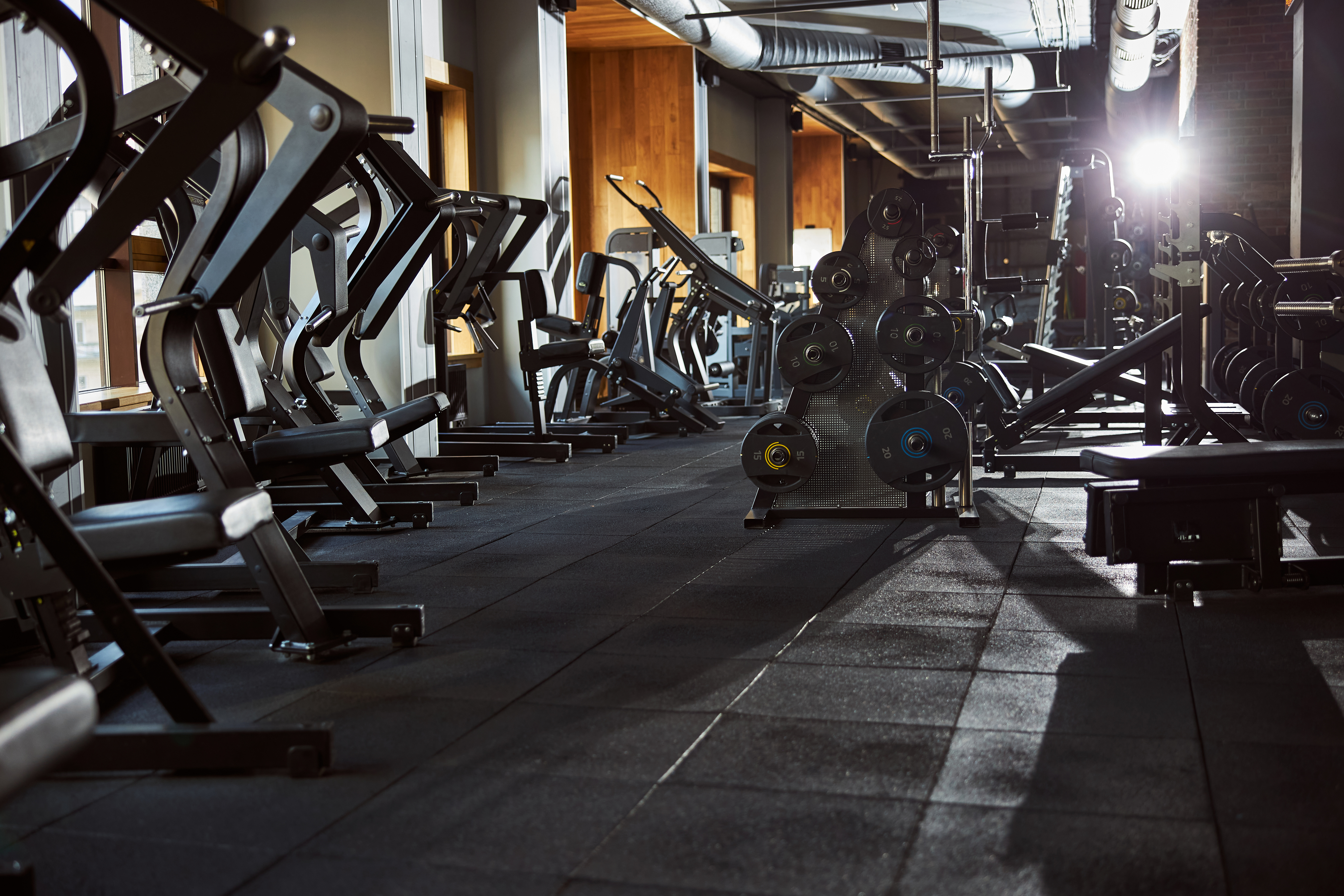 No people photo of an empty gym well-equipped with all kinds of machines